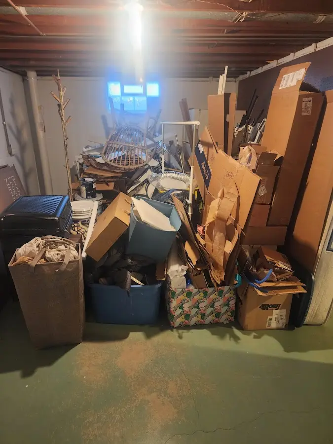 Roll-off dumpster container at job site for 2 Yard Dumpster Rental in Rock Valley